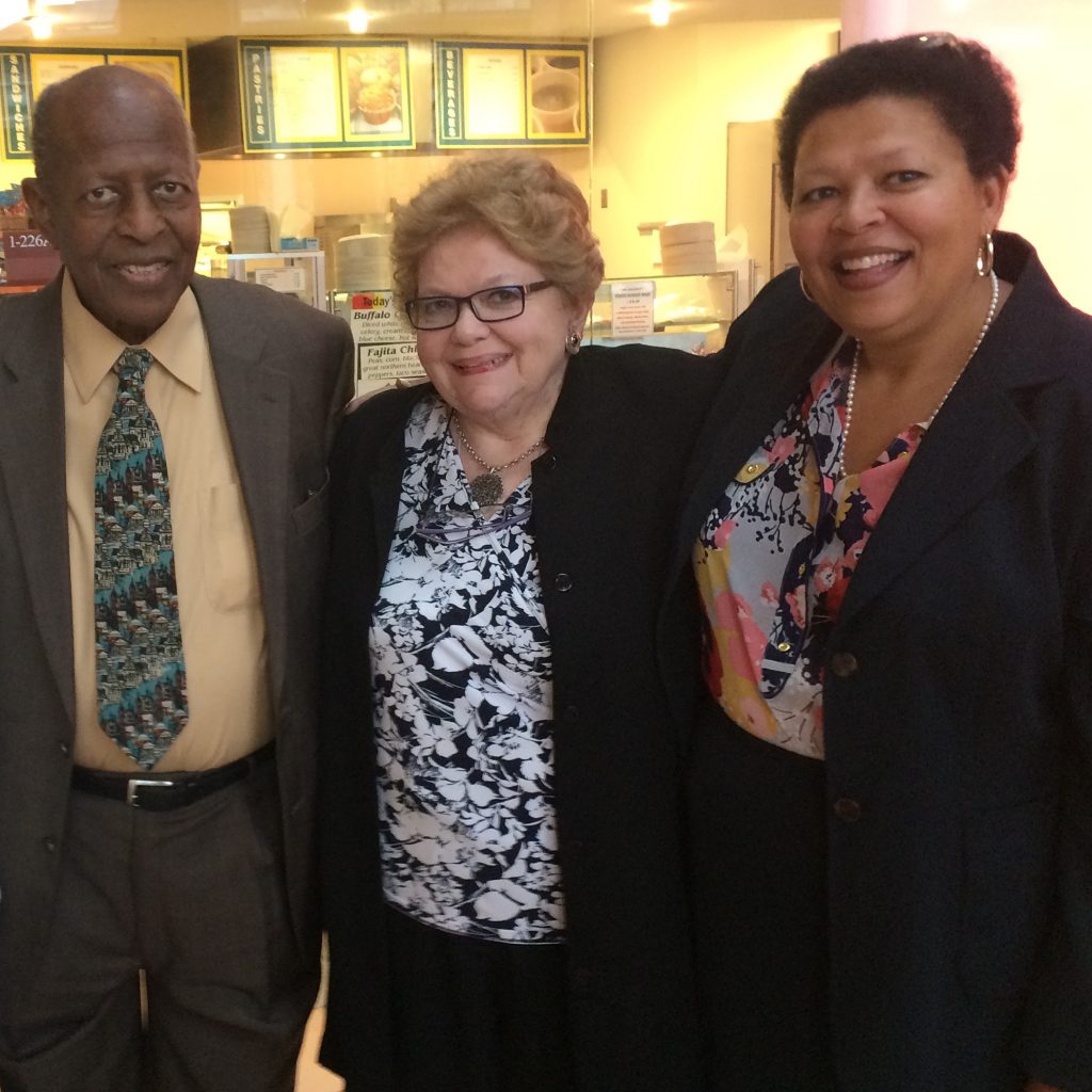 three people standing
