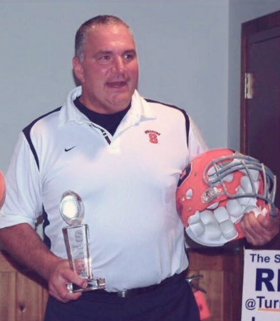 man with award