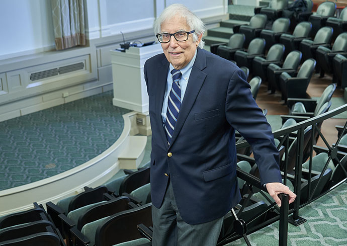 David Bennet standing in auditorium