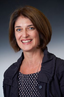 Professor Kelly Chandler-Olcott poses for portrait photo