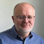 head shot of Roger Hallas