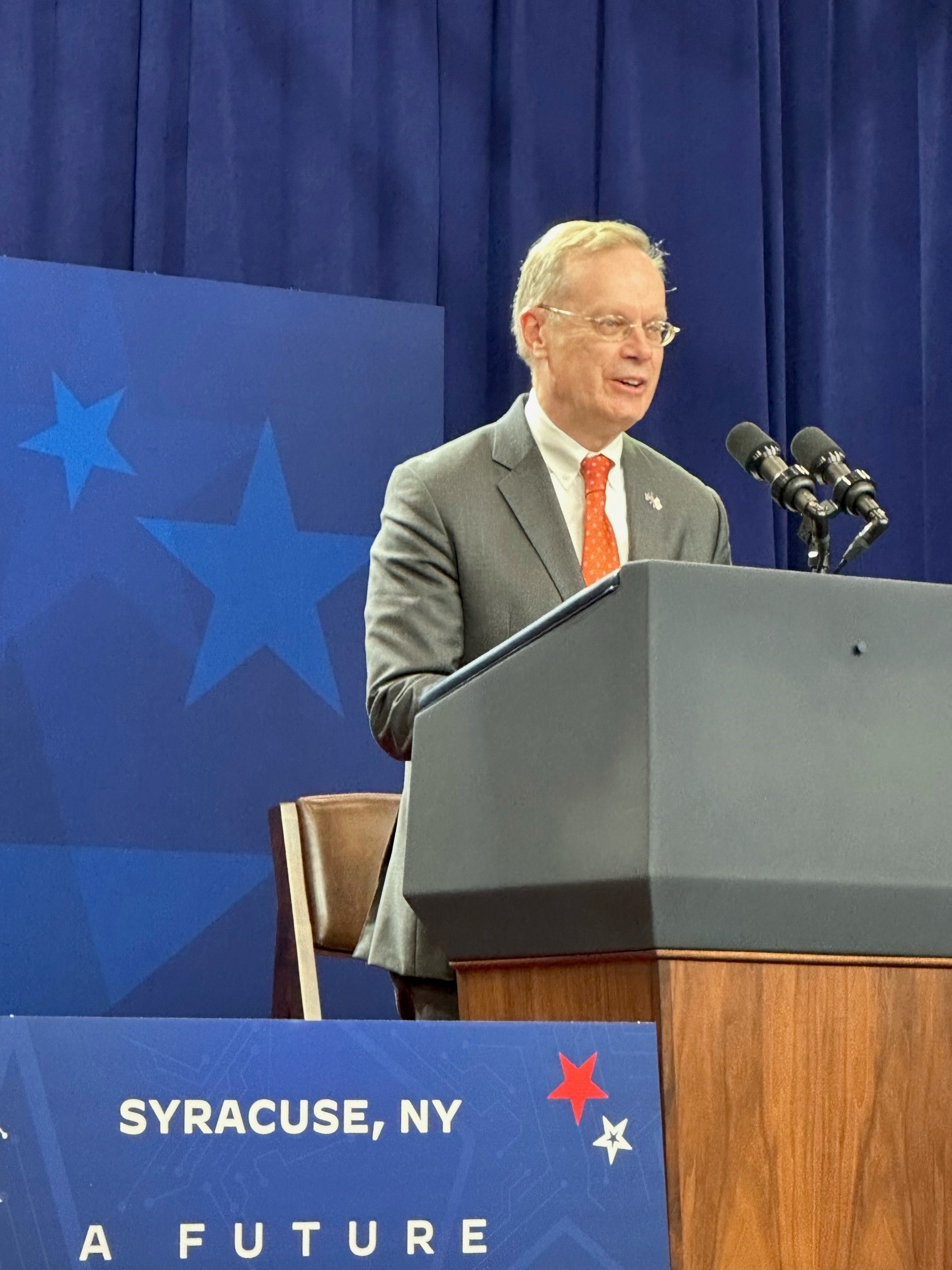 person speaking at podium