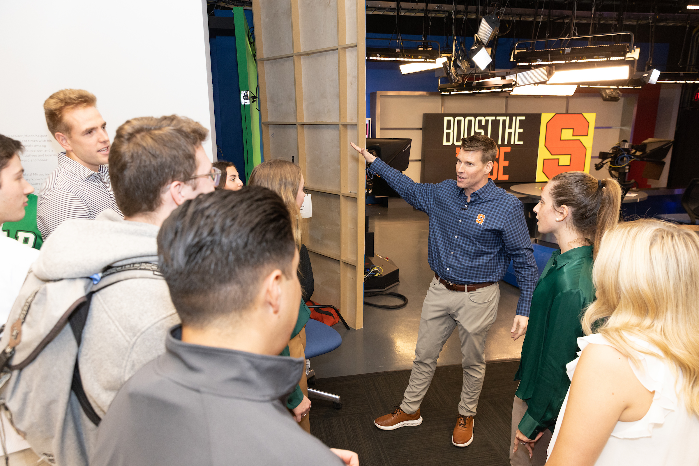 Man speaking to a group of students.