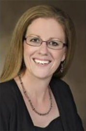 Individual smiling for a headshot