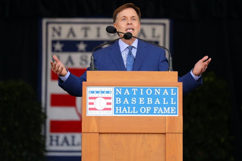 Man speaking into a microphone in Cooperstown at the Baseball Hall of Fame.