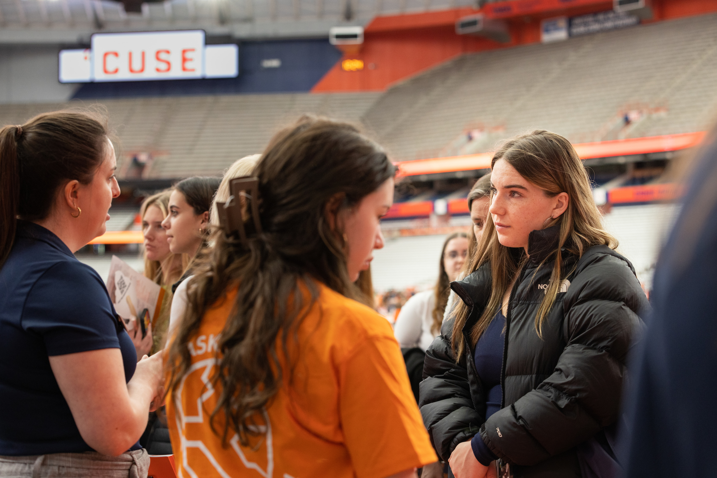 Reception in the JMA Wireless Dome where University staff members talk to parents and accepted students.