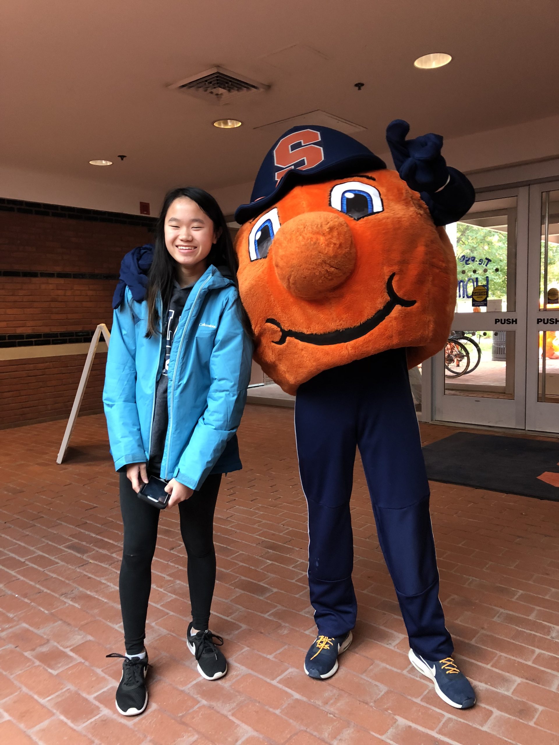Otto posing with a girl smiling. 