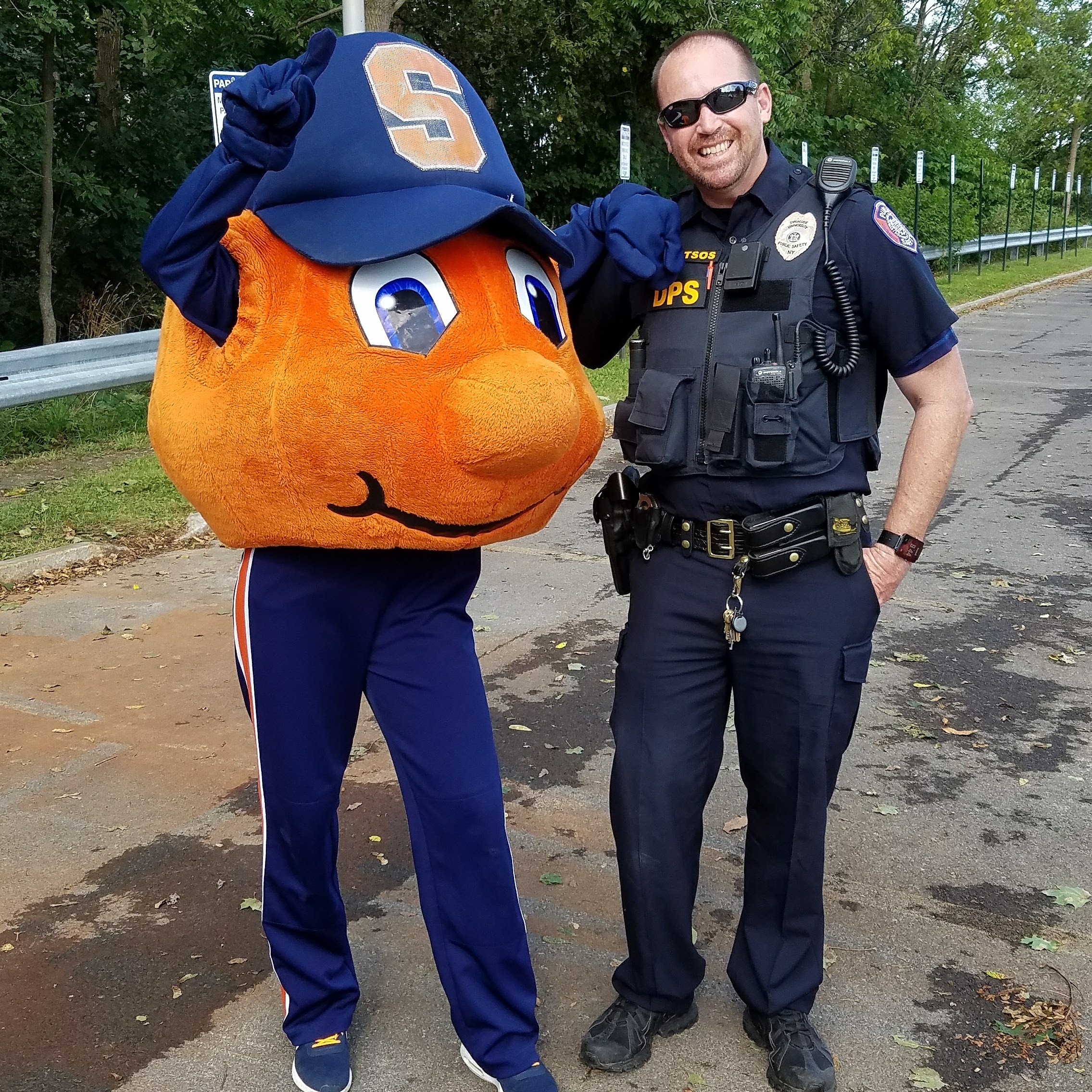 Man in uniform standing with Otto.