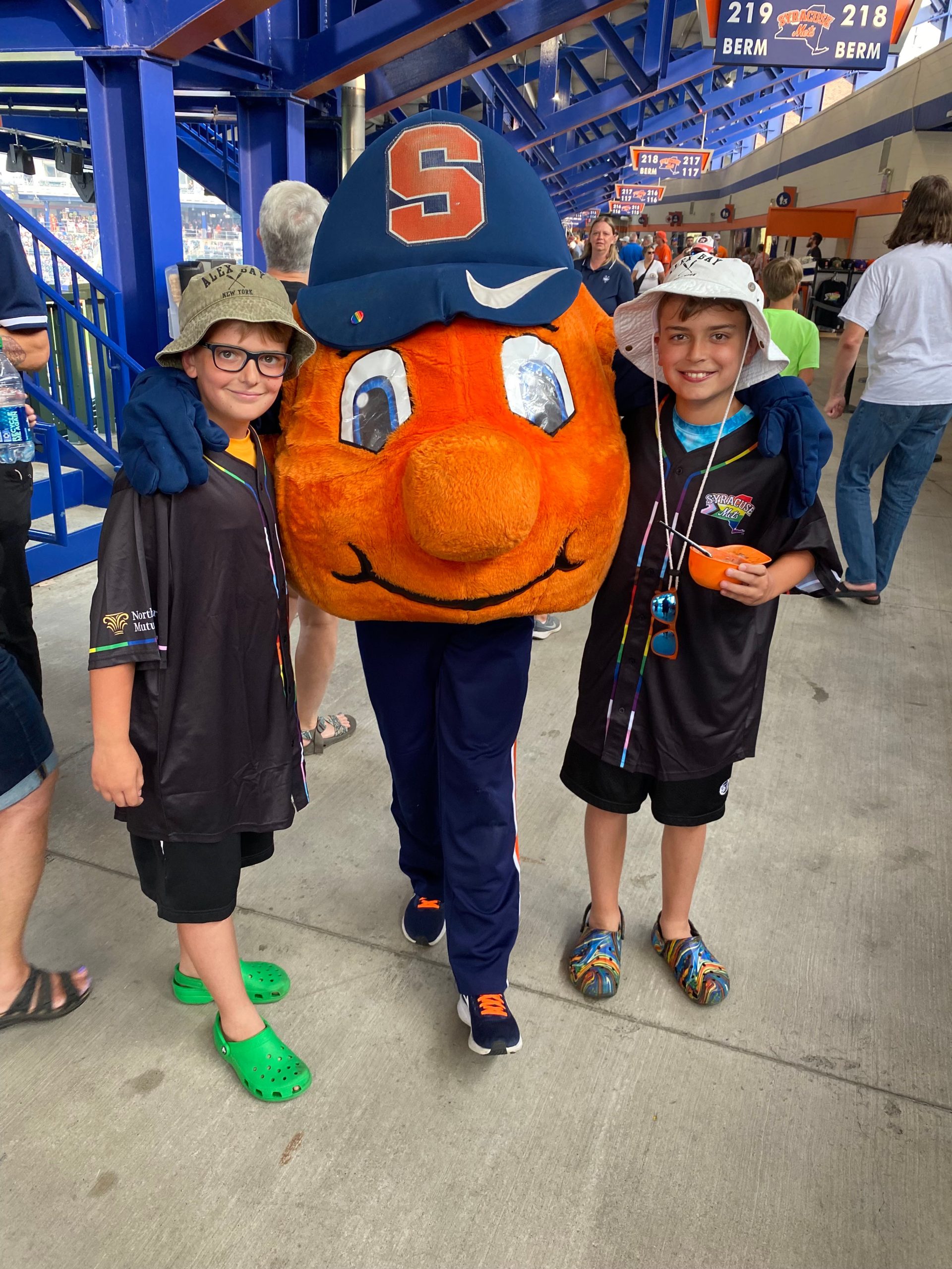 Otto standing with two boys.