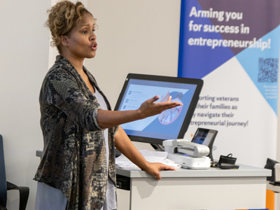 A professor talks about entrepreneurship to a group of veterans.