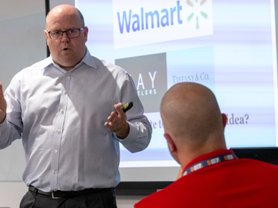 A man discusses entrepreneurship strategy during Syracuse University's Entrepreneurship Bootcamp for Veterans.