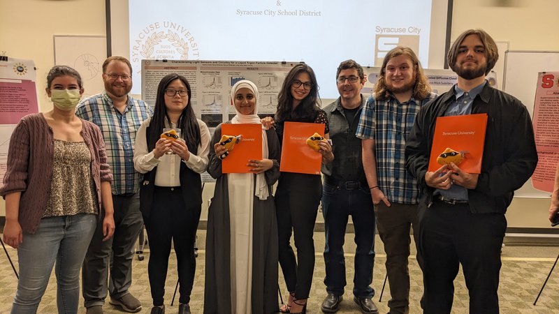 Group of students pose with instructors during a summer physics program