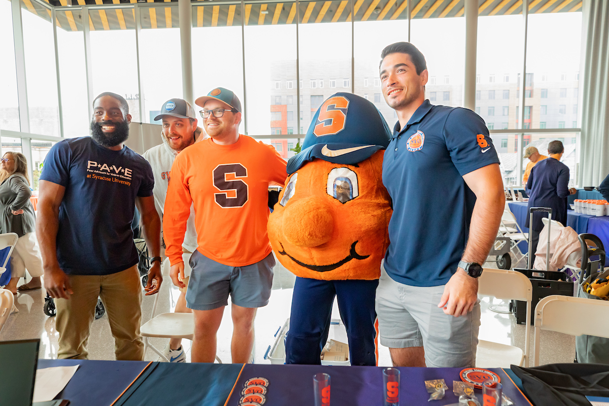 four community members pose with Otto at the new student veteran orientation.