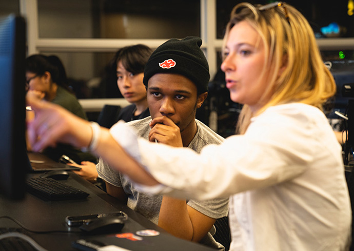 two people looking at computer screen