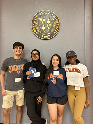 Four students standing together
