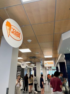 Students gather in Goldstein Food Hall waiting to purchase food.