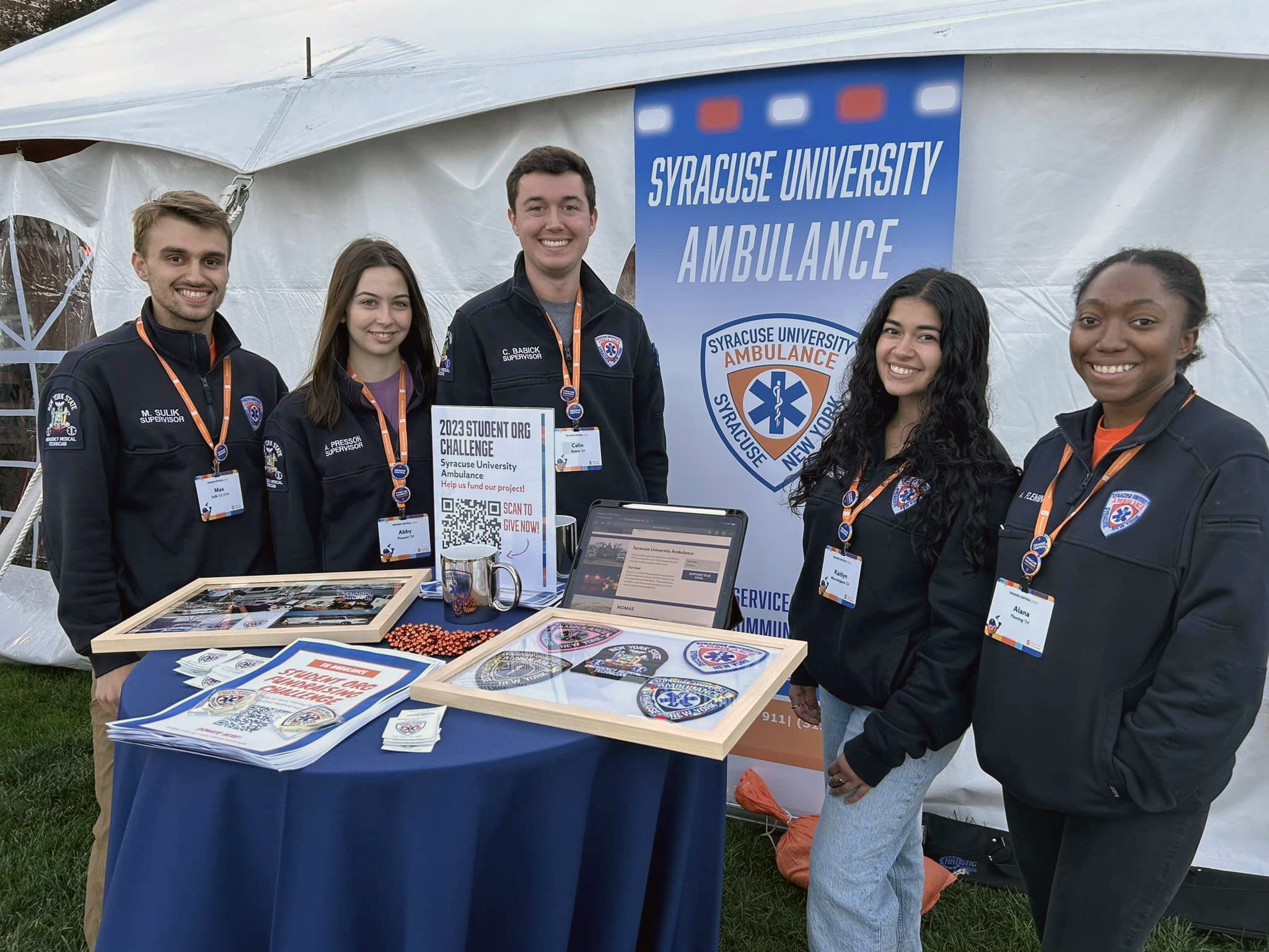 members of Syracuse University Ambulance student group participate in a crowdfunding challenge during Orange Central