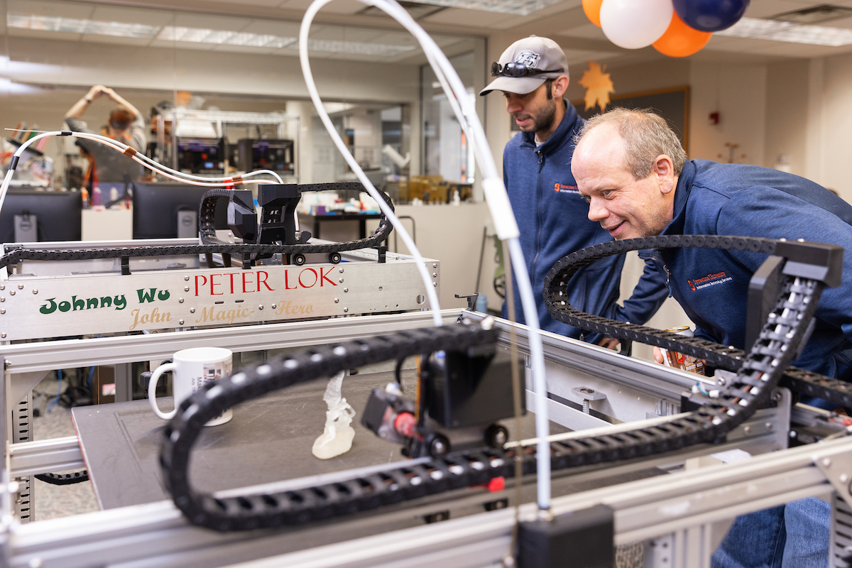 two people looking at equipment in MakerSpace