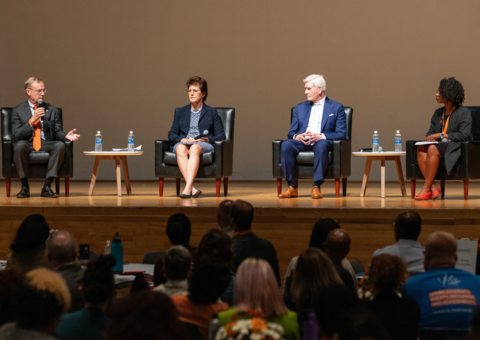 University leadership serve as panelists on the stage at the DEIA symposium