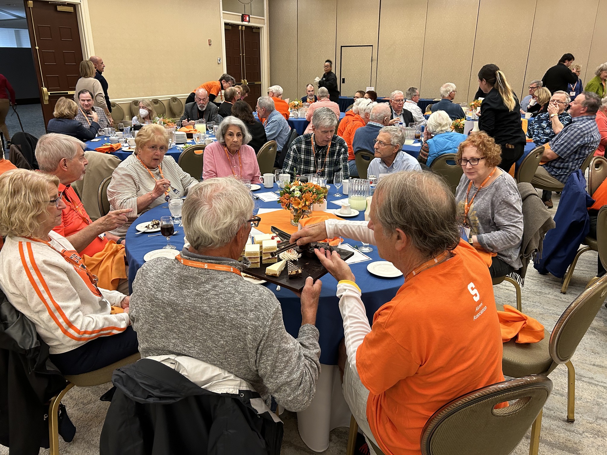 groups of people seated at dining tables