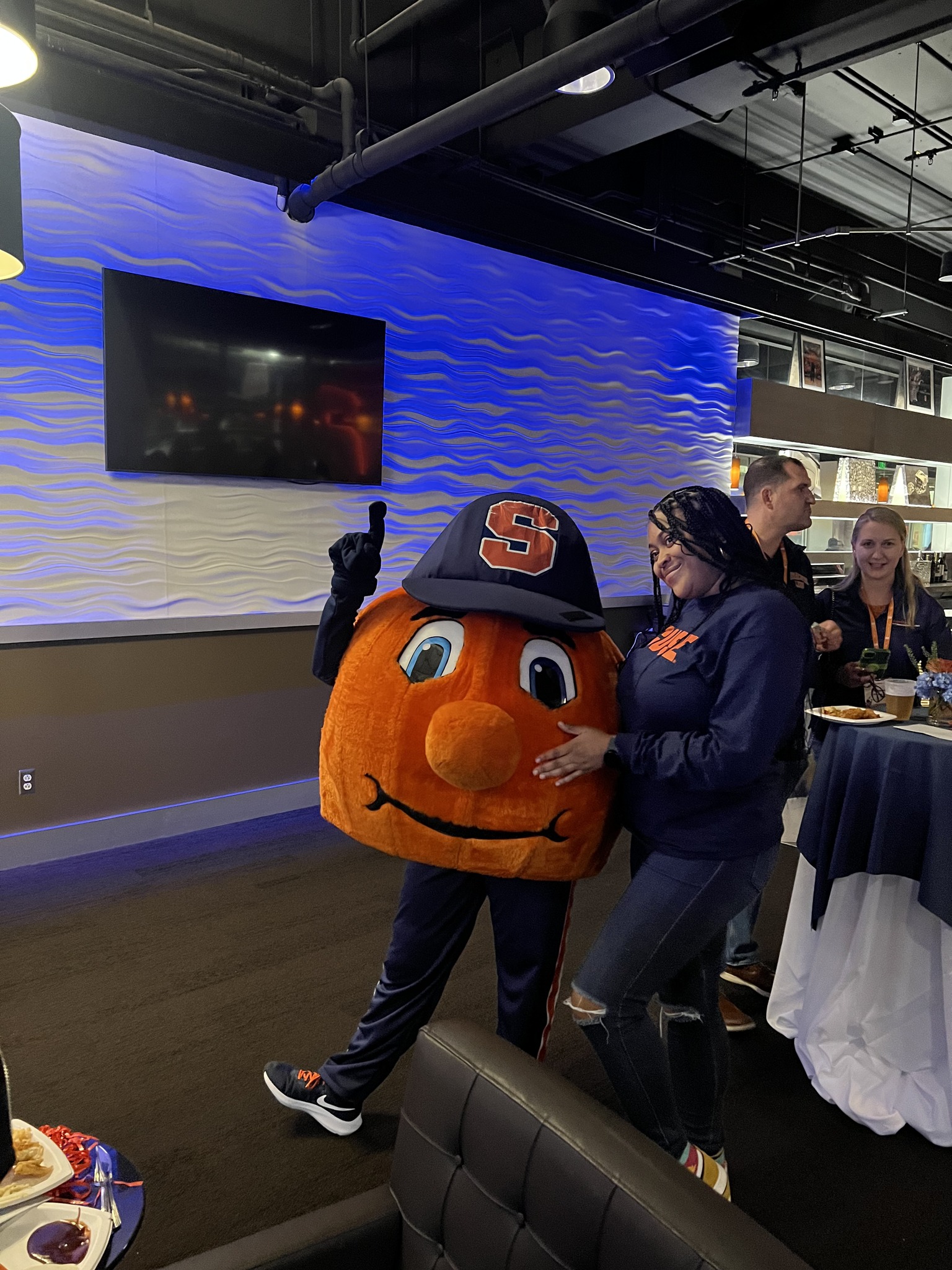 person standing with Otto the Orange