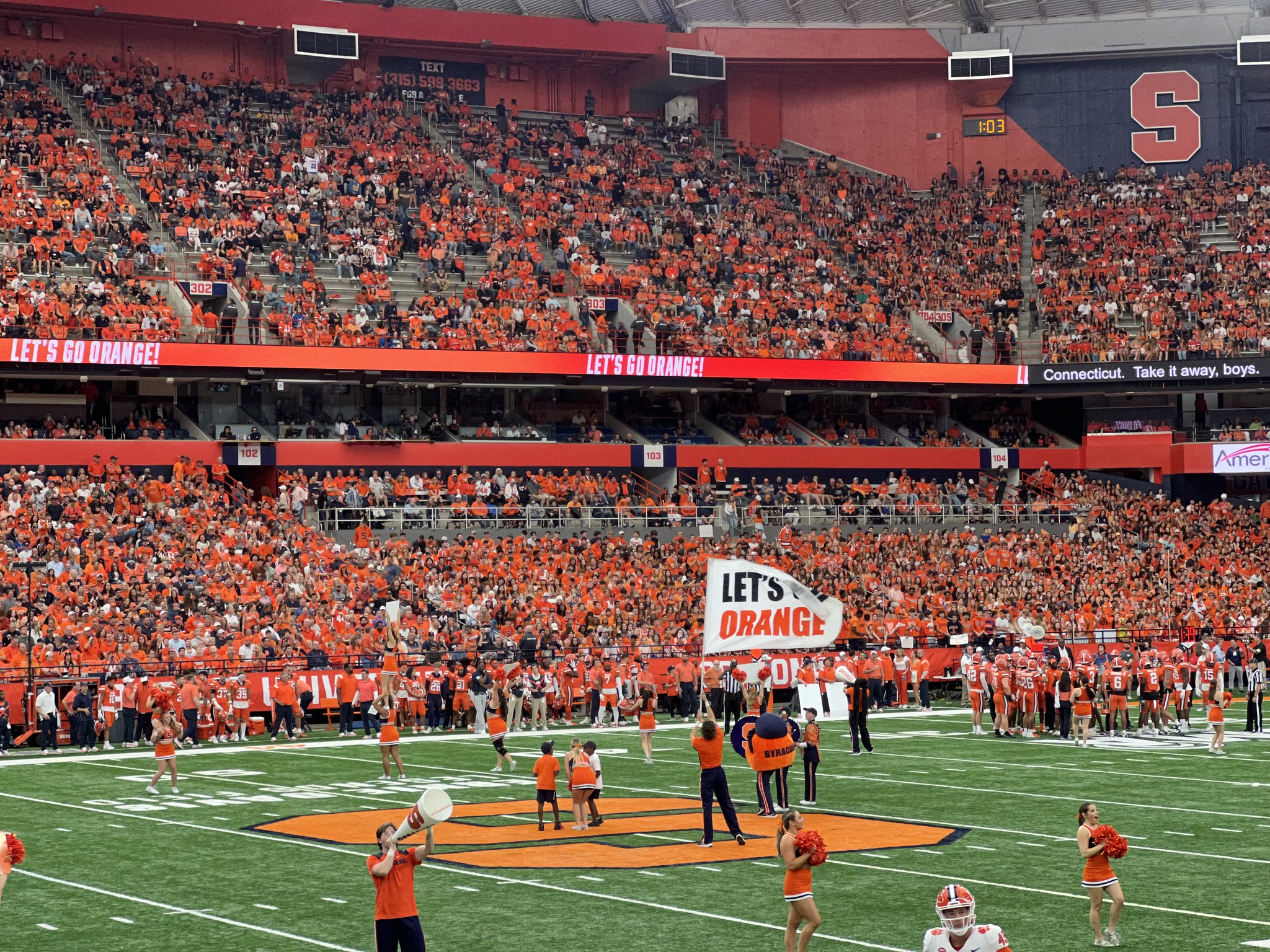 a packed stadium of people inside JMA Wireless Dome
