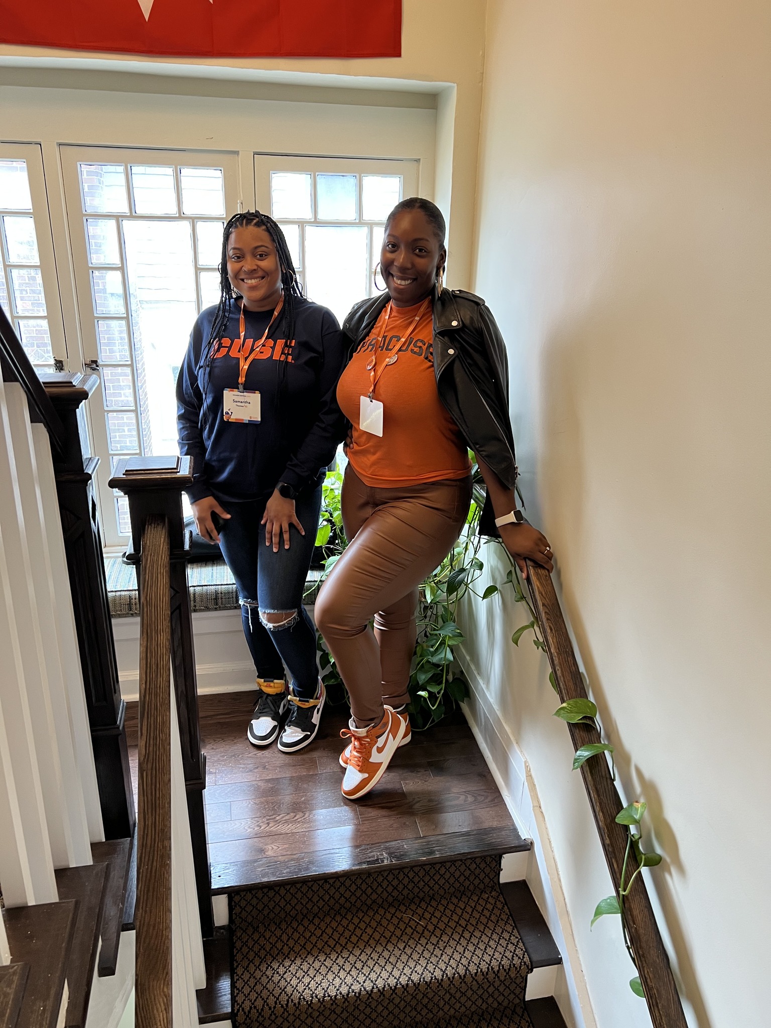 two people standing in stairway
