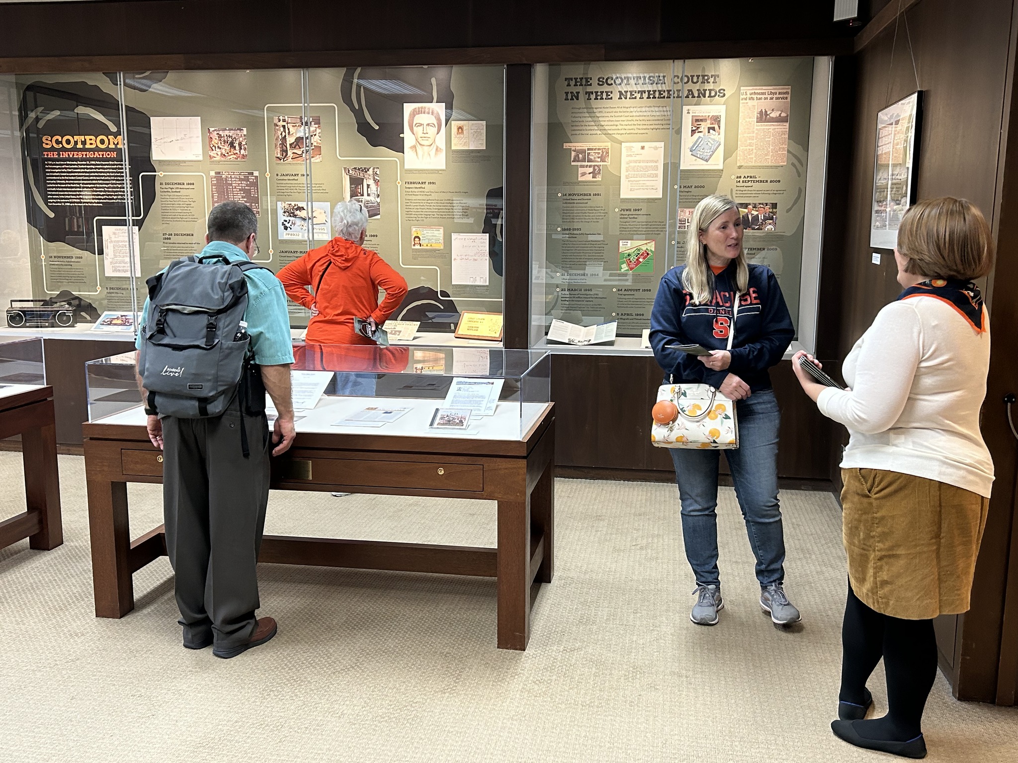 people standing looking at exhibition