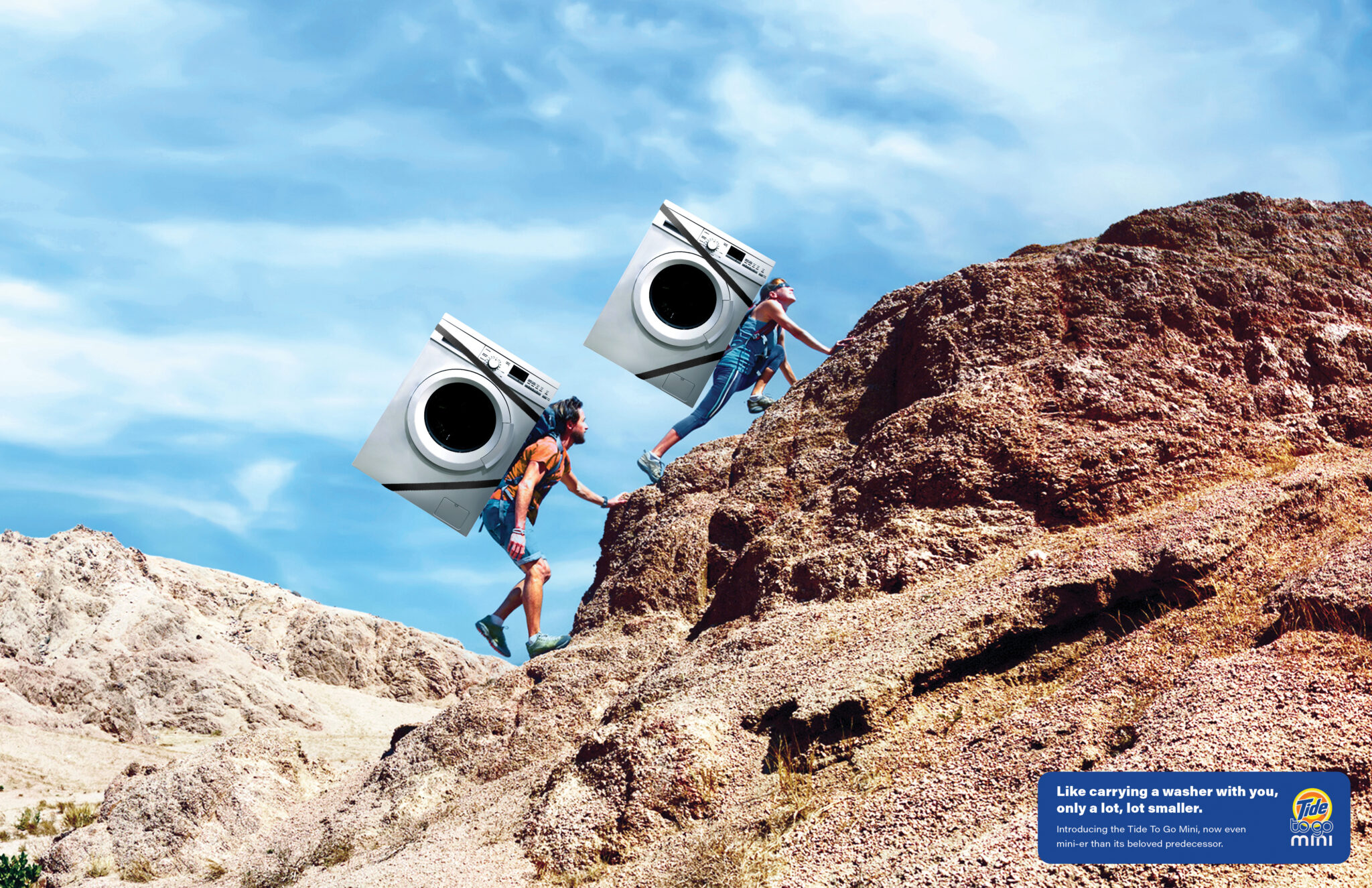 a Newhouse student's ad for Tide To Go Mini shows two people hiking a mountain with washing machines strapped to their backs