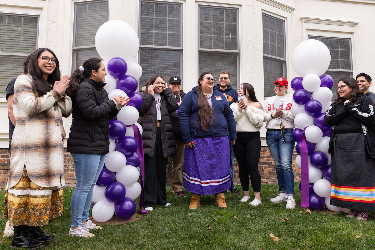 Group of people standing out 113 Euclid, home to the Native Student Program, right after the ribbon cutting ceremony.