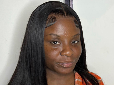 A woman poses for a headshot indoors.