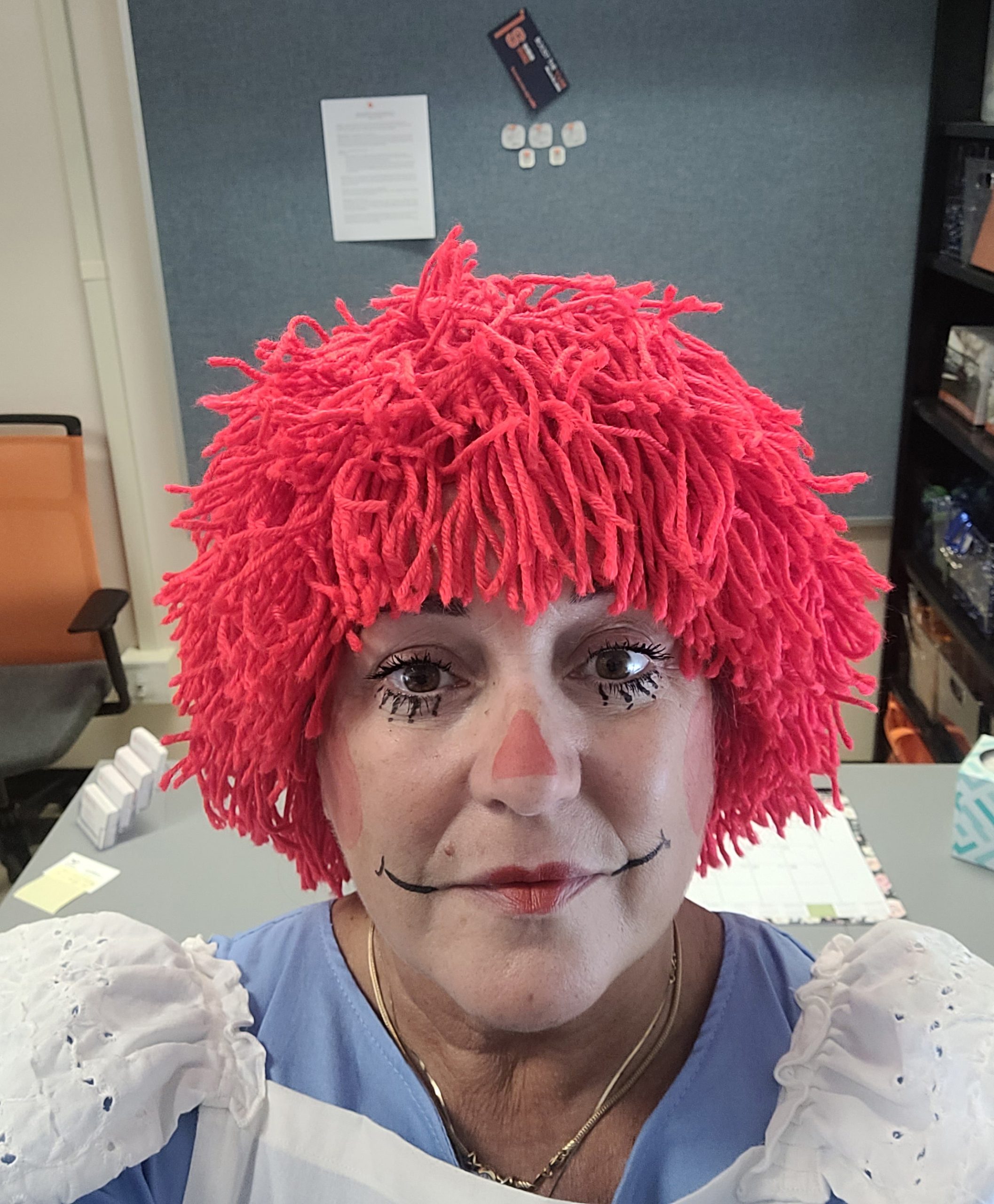Woman dressed up as Raggedy Ann.