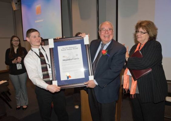 Alejandro Garcia receiving Social Justice Award in 2013