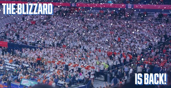 Student section in white t-shirts in the JMA Wireless Dome