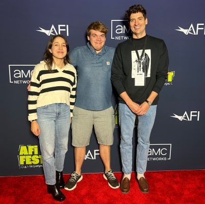 Alejandra Vasquez, Sam Clark and Sam Obsorn pose together on the red carpet at the American Film Institute festival