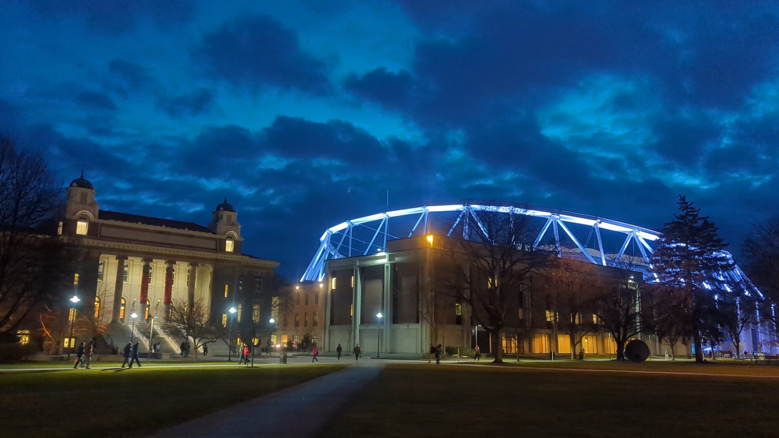 View of the Quad and Carnegie Library with a dark blue sky. 