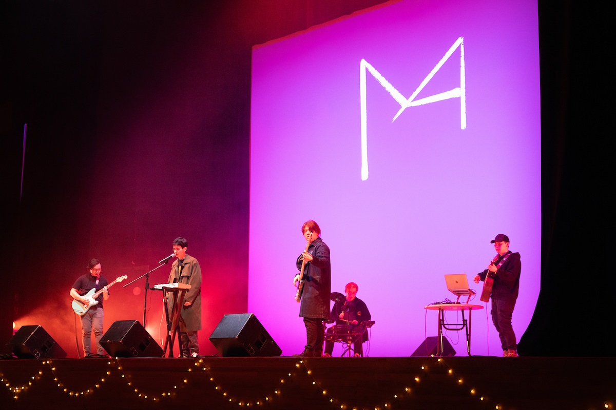 group of musicians performing on stage