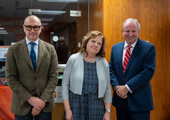 Dean Michael Speaks, librarian Barbara Opar and Dean David Seaman pose together in Bird Library