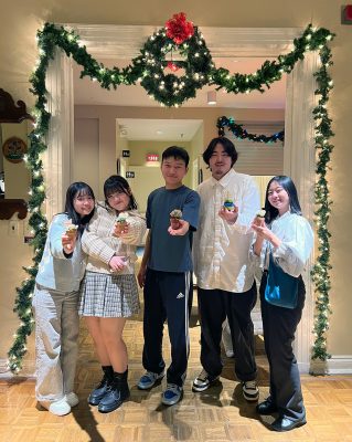 five students hold up a potted succulent from a stressbuster activity