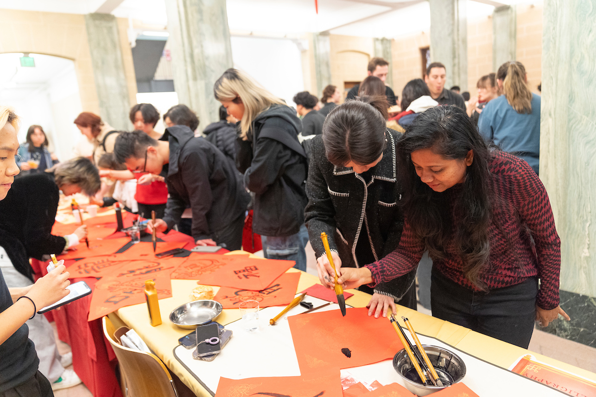 People at a table participating in an activity.