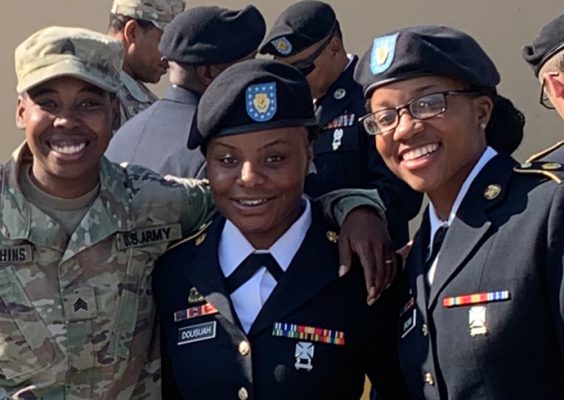 Three members of the military smile while posing for headshots.