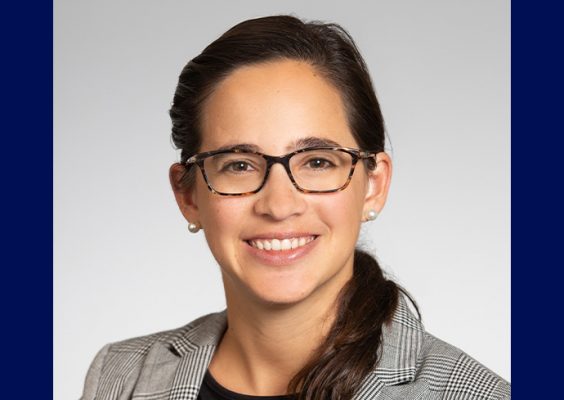 A woman smiles while posing for a headshot.