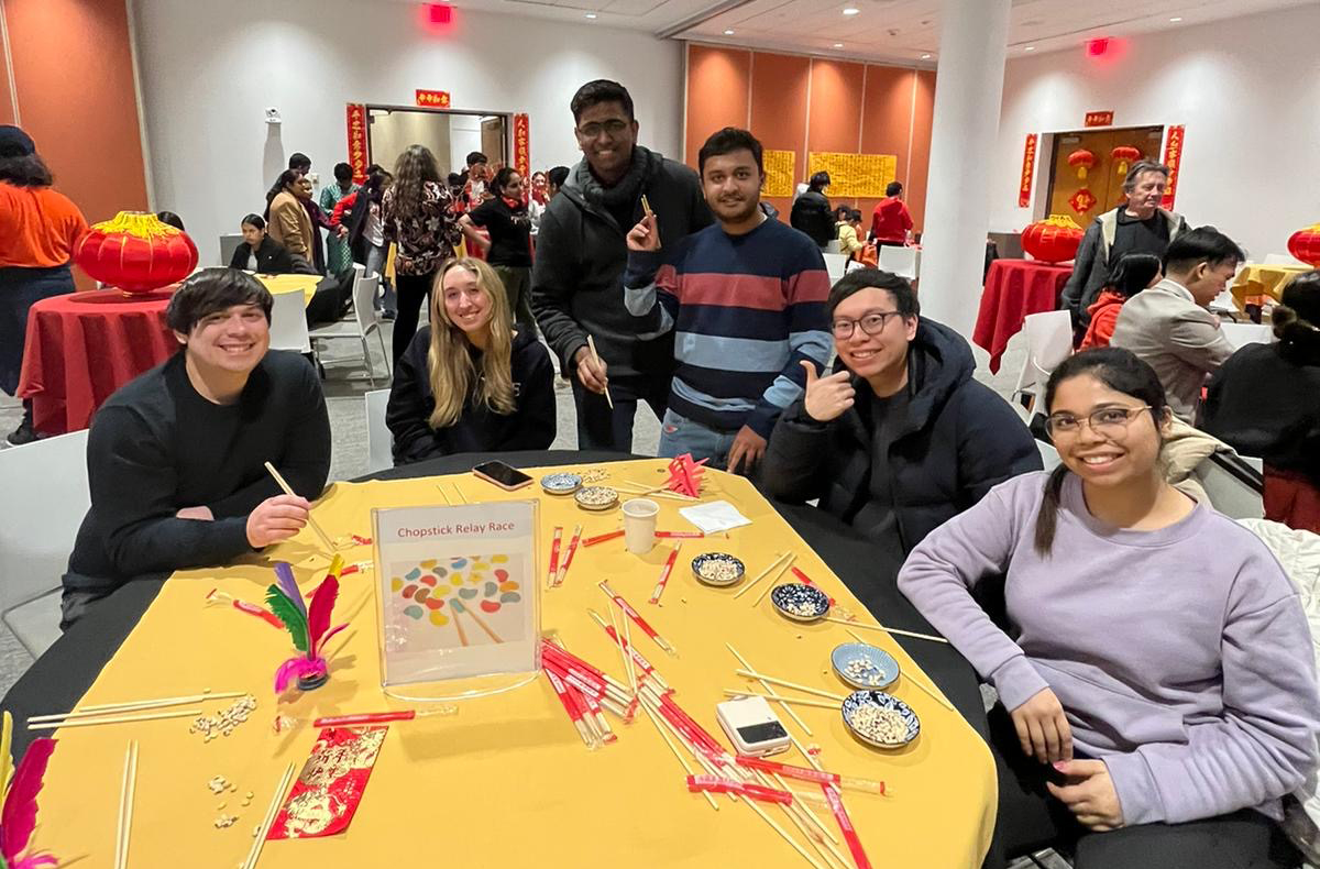 Group of people sitting around a table.