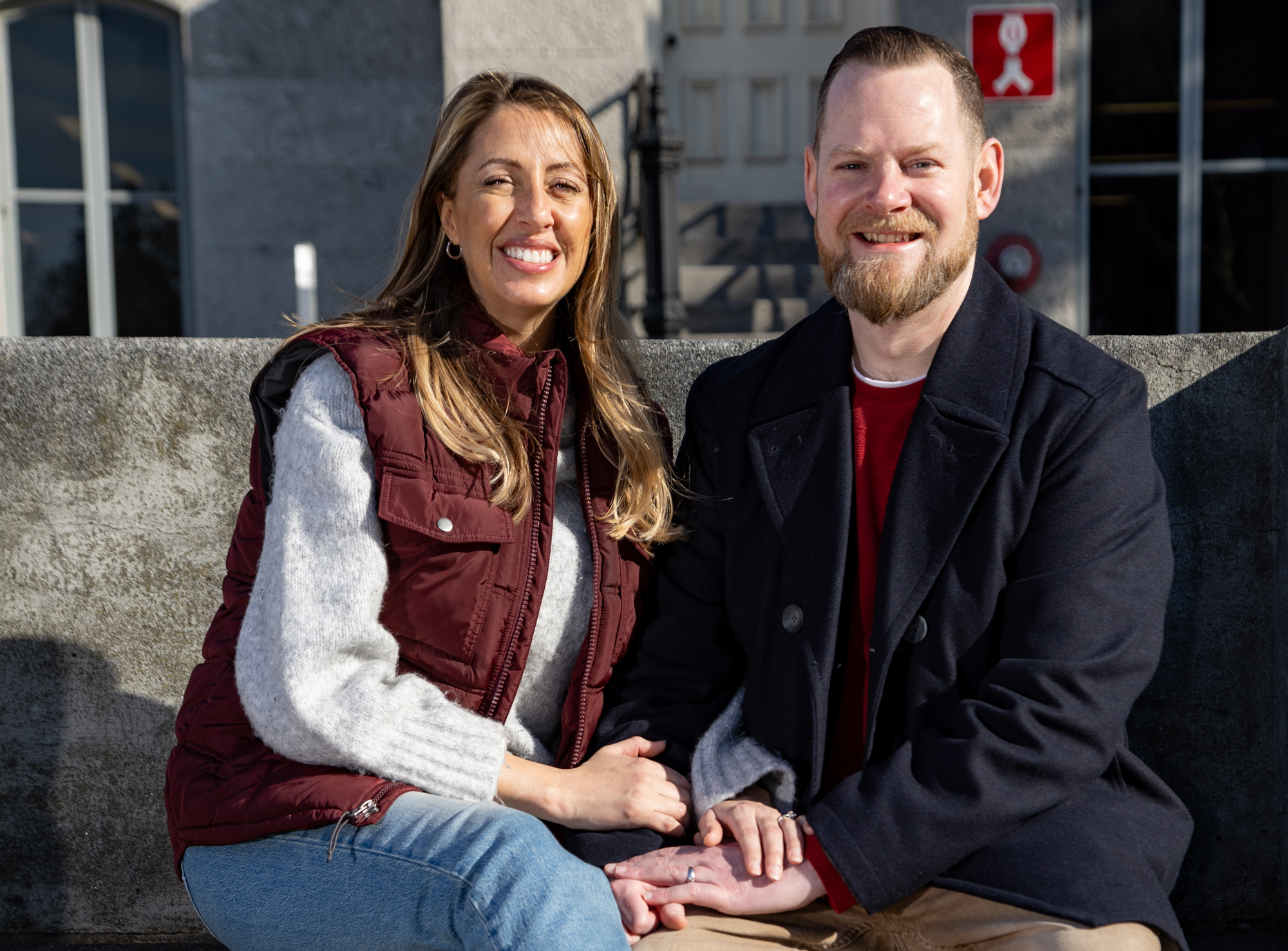 Colleen and Michael Drum pose together on the Kissing Bench