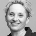 person looking ahead smiling, black and white photo