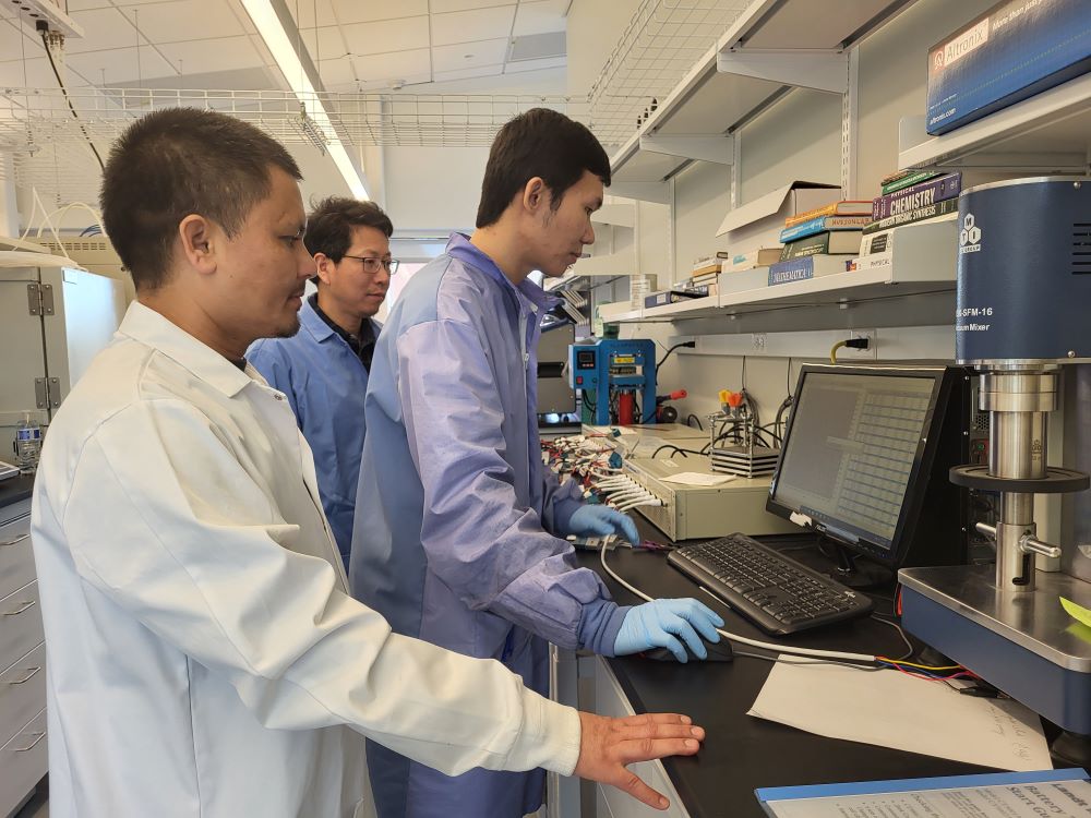 three men doing testing in science lab