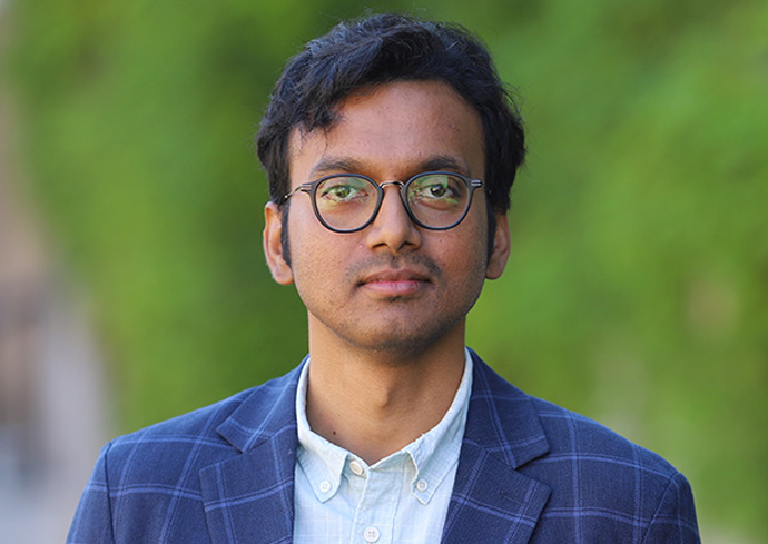 A faculty member poses for a headshot.