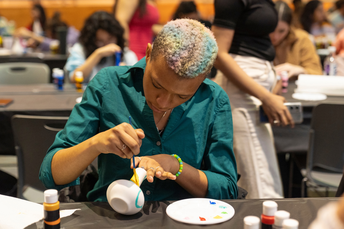 A student paints.