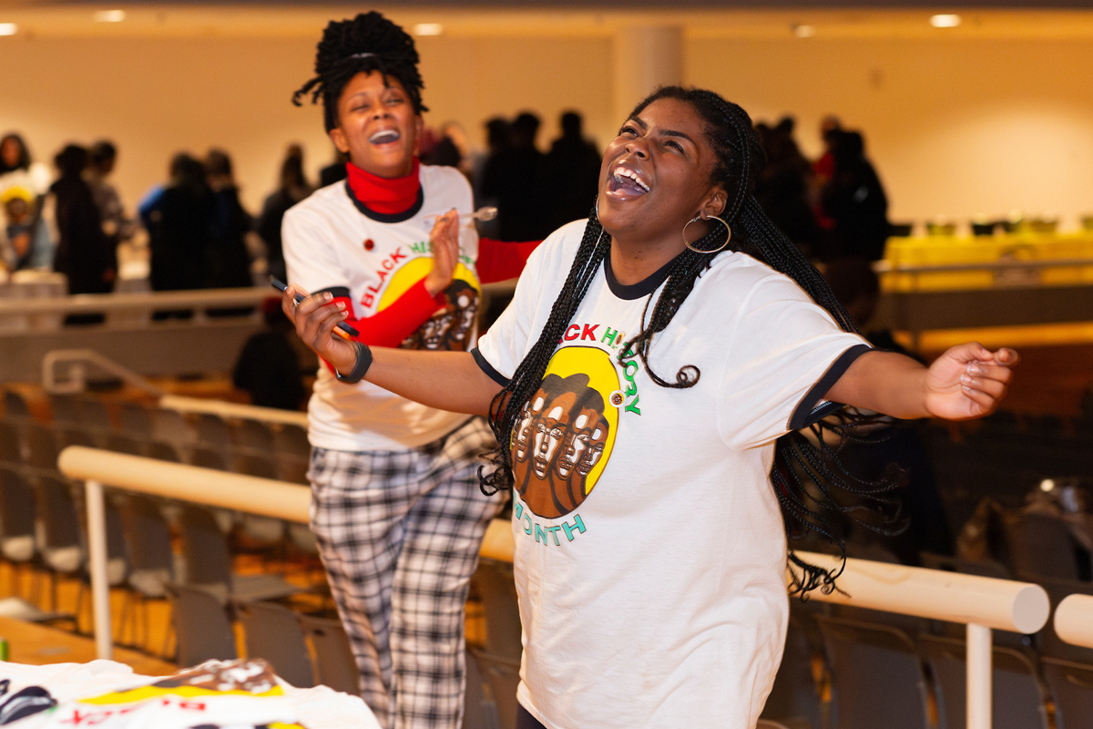 Two students share a laugh.
