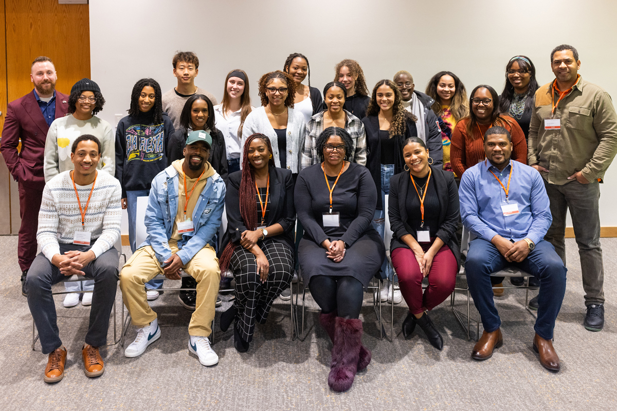 Alumni pose for a group photo after sharing career advice.
